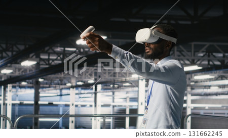 Engineer using VR headset in data center to update server tech, configuring equipment using software tools. Server hub employee reviewing hardware analytics using virtual reality 131662245