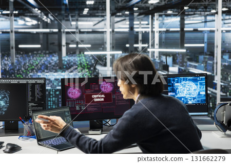 Data center software developer struggling to fix malfunctions while using AI tools. Server farm IT expert receiving critical error while using artificial intelligence to optimize system health 131662279