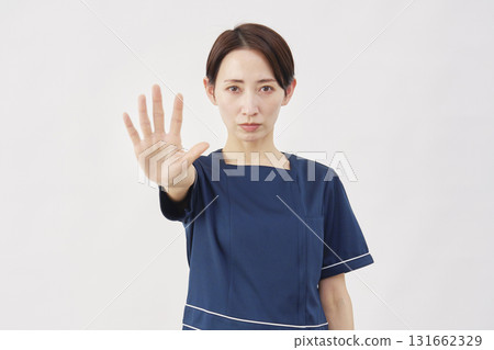 Female beauty nurse stopping gesture white background 131662329