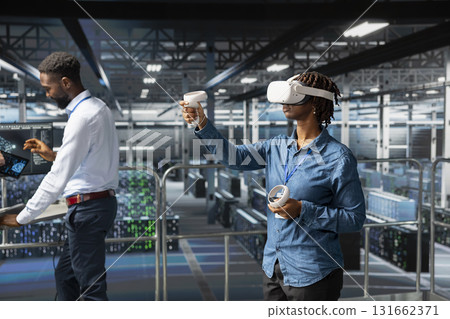 Black female admin with VR headset using artificial intelligence neural network tools, ensuring data visualization checkup. Software developer using AI programming language and virtual reality. 131662371