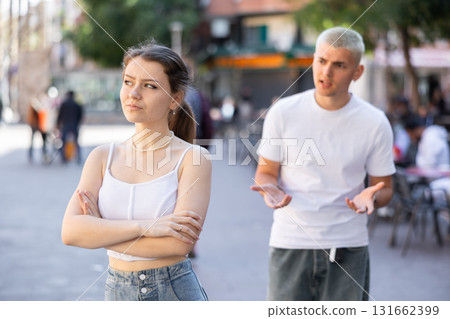guy and his girlfriend quarreled on the street guy and his girlfriend quarreled on the street 131662399