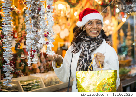 Portrait of a positive Latin American woman who came to a Christmas fair 131662529