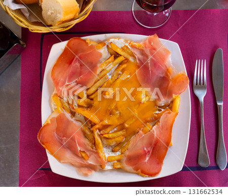 Dish of starry eggs with ham and French fries Dish of starry eggs with ham and French fries 131662534