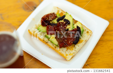 Sandwiches with avocado, fig jam and stewed peppers Sandwiches with avocado, fig jam and stewed peppers 131662541