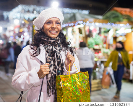 Latin woman at christmas fair 131662584