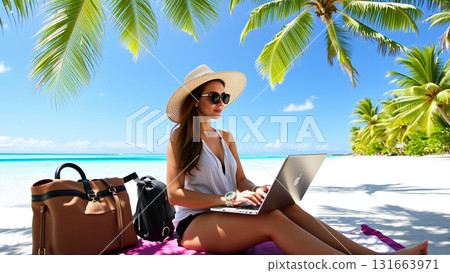 Woman working on laptop while sitting on tropical beach 131663971