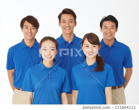 Group photo of smiling staff in blue uniforms Group photo of smiling staff in blue uniforms 131664112