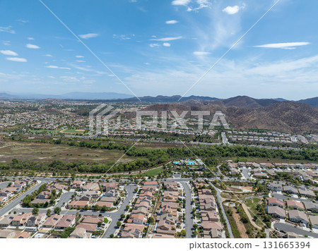 Aerial view of a sprawling neighborhood of family homes in Menifee, California, USA. Aerial view of a sprawling neighborhood of family homes in Menifee, California, USA. 131665394