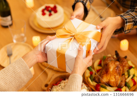 Family having a Christmas home party 131666696