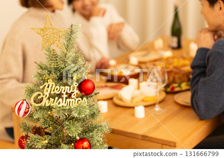 Family having a Christmas home party 131666799