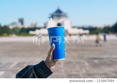 woman hand holding Pearl milk tea with tapioca ball traveler at National Chiang Kai shek Memorial, Chun Shui Tang brand a famous Taiwanese bubble tea of Taiwan. Taipei, Taiwan, 12 January 2025 woman hand holding Pearl milk tea with tapioca ball traveler at National Chiang Kai shek Memorial, Chun Shui Tang brand a famous Taiwanese bubble tea of Taiwan. Taipei, Taiwan, 12 January 2025 131667084