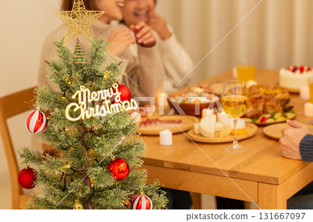 Family having a Christmas home party Family having a Christmas home party 131667097