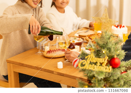 Family having a Christmas home party 131667098