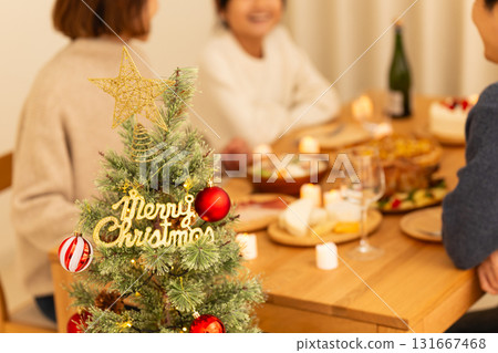 Family having a Christmas home party 131667468