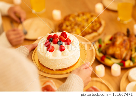 Family having a Christmas home party 131667471