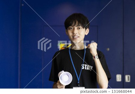 A man working part-time as an event staff member 131668044