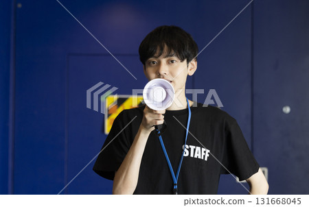 A man working part-time as an event staff member 131668045