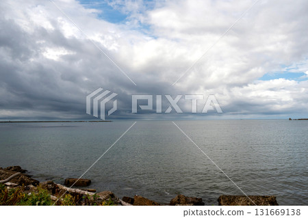 Overcast seascape with dramatic layered clouds Overcast seascape with dramatic layered clouds 131669138