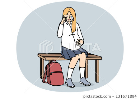 Pregnant schoolgirl is crying, sitting on bench and experiencing stress due to early motherhood 131671894