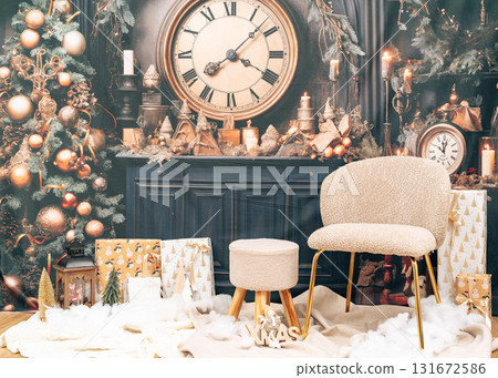 Beautiful Christmas scene with soft chair, wrapped presents, and glowing tree lights. Elegant festive home decoration Beautiful Christmas scene with soft chair, wrapped presents, and glowing tree lights. Elegant festive home decoration 131672586