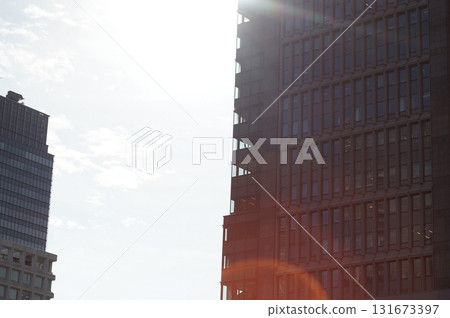 Sunset shining through the gap between buildings 131673397