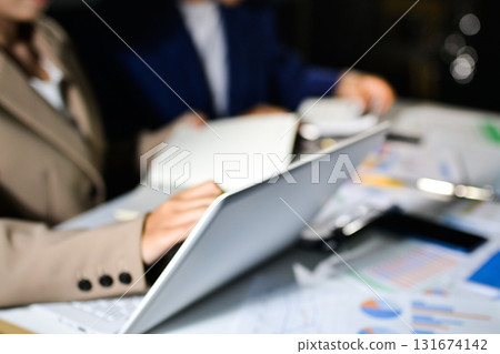 business people in meeting discussing plans together business people in meeting discussing plans together 131674142