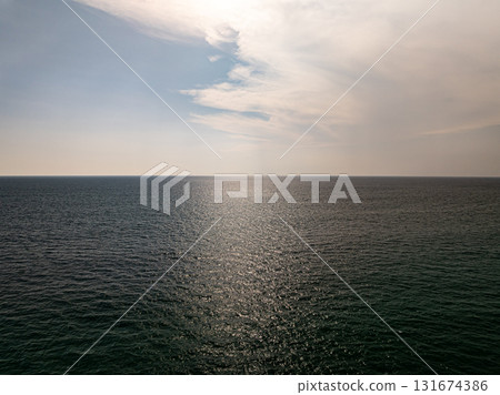 Beautiful sky sunset or sunrise clouds over sea nature background 131674386