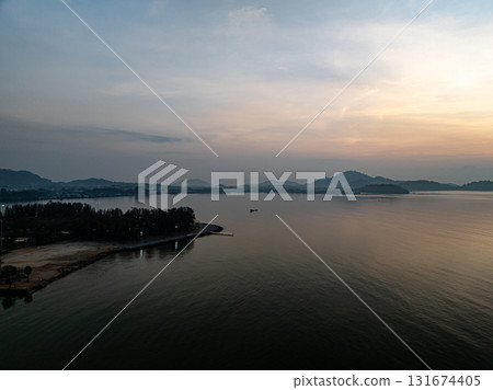 Beautiful sky sunset or sunrise clouds over sea nature background Beautiful sky sunset or sunrise clouds over sea nature background 131674405