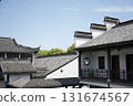 Traditional Chinese architecture with white walls and black roof tiles against the blue sky 131674567