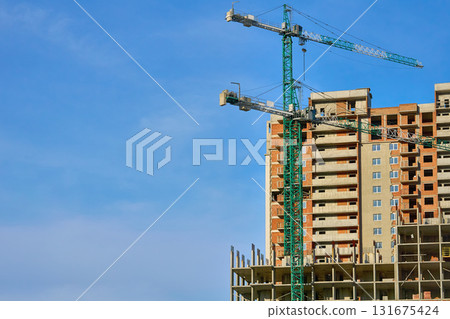 Construction site.New building.Large high rise cranes Construction site.New building.Large high rise cranes 131675424