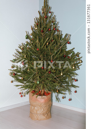 Beautiful Christmas defocused blurred background with Christmas tree lights in the evening. Festive New Year's mood, flash photography, retro modern style Beautiful Christmas defocused blurred background with Christmas tree lights in the evening. Festive New Year's mood, flash photography, retro modern style 131677361