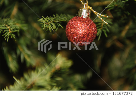 Beautiful Christmas defocused blurred background with Christmas tree lights in the evening. Festive New Year's mood, flash photography, retro modern style 131677372