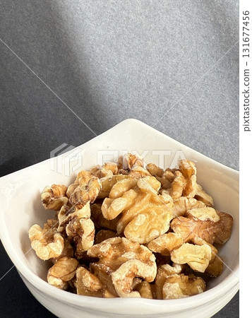 Peeled walnuts in a bowl. Closeup of walnuts in bowl. 131677456