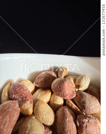 Closeup of roasted salted peanuts. Closeup of roasted salted peanuts. 131677458