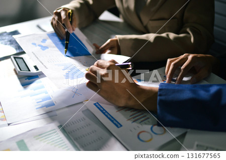 business people in meeting discussing plans together business people in meeting discussing plans together 131677565