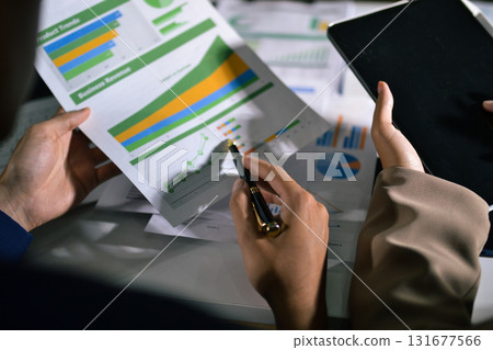 business people in meeting discussing plans together business people in meeting discussing plans together 131677566