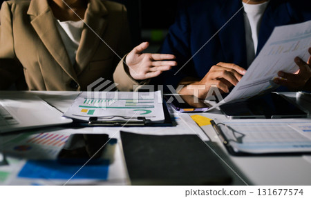 business people in meeting discussing plans together 131677574