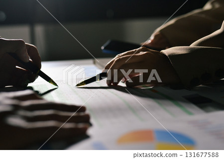 business people in meeting discussing plans together 131677588