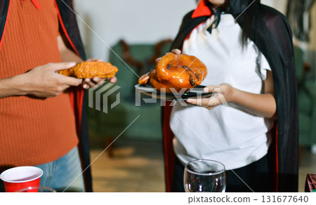 People having fun at Halloween party People having fun at Halloween party 131677640