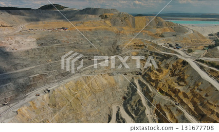 Aerial of open mine and heavy mining equipment Aerial of open mine and heavy mining equipment 131677708