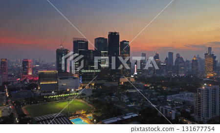 Illuminated skyscrapers and Lumpini park in Bangkok 131677754