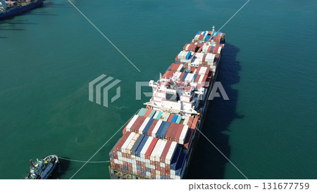 Cargo ship filled with containers in port area 131677759