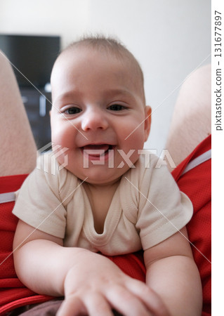 Adorable Baby Close-Up with Red Shorts Background 131677897