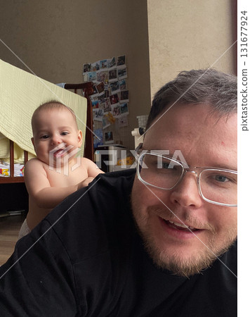 Playful Bonding Time with Baby and Dad Playful Bonding Time with Baby and Dad 131677924