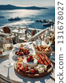 Seafoods, shrimp, appetizers, salads on table. Greek food experience, Turkish style fish restaurant. Santorini, Turkey, or Greece. Aegean seaside dining. Glass white wine, fresh flavors. Vertical 131678027