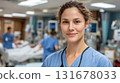 Medical assistant wearing blue scrubs in hospital . Friendly young female European professional doctor or nurse attractive young female nurse at workplace 131678033