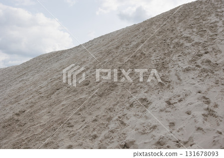 Large sandy slope with footprints Large sandy slope with footprints 131678093