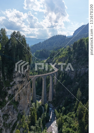 Landwasser viaduct railway bridge curving through swiss alps Landwasser viaduct railway bridge curving through swiss alps 131678100