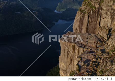People enjoying view from preikestolen cliff above lysefjord, norway 131678101