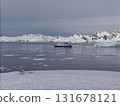 Expedition ship navigating icy waters in antarctica 131678121
